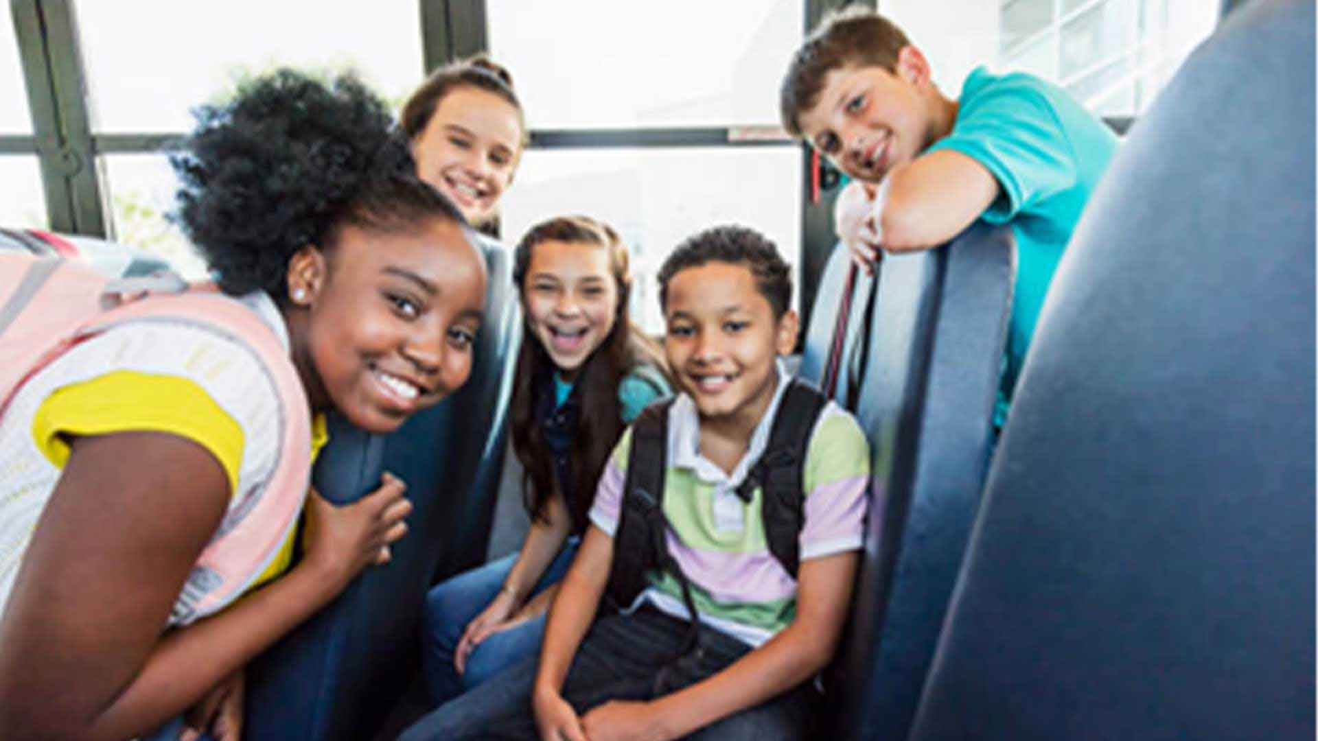 Multi-ethnic junior high students riding school bus stock photo... Save Preview Edit Multi-ethnic junior high students riding school bus A multi-ethnic group of five junior high or middle school students, 11 to 13 years old, riding a school bus. They are smiling at the camera. Child Stock Photo Description A multi-ethnic group of five junior high or middle school students, 11 to 13 years old, riding a school bus. They are smiling at the camera.